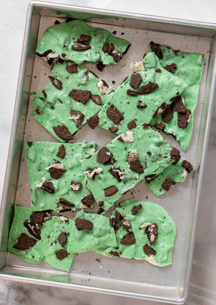 Mint Oreo Bark pieces on baking sheet