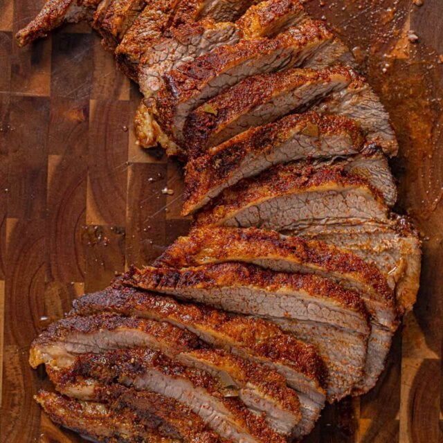Texas Oven-Roasted Beef Brisket, sliced on cutting board