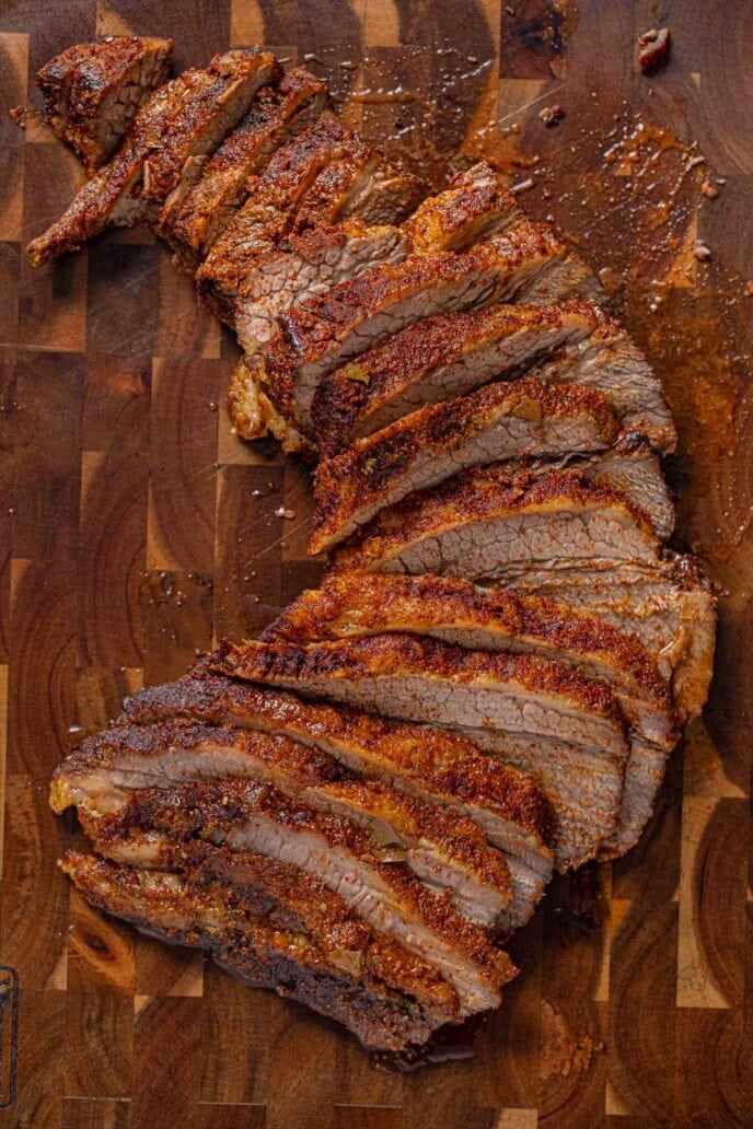 Texas Oven-Roasted Beef Brisket, sliced on cutting board