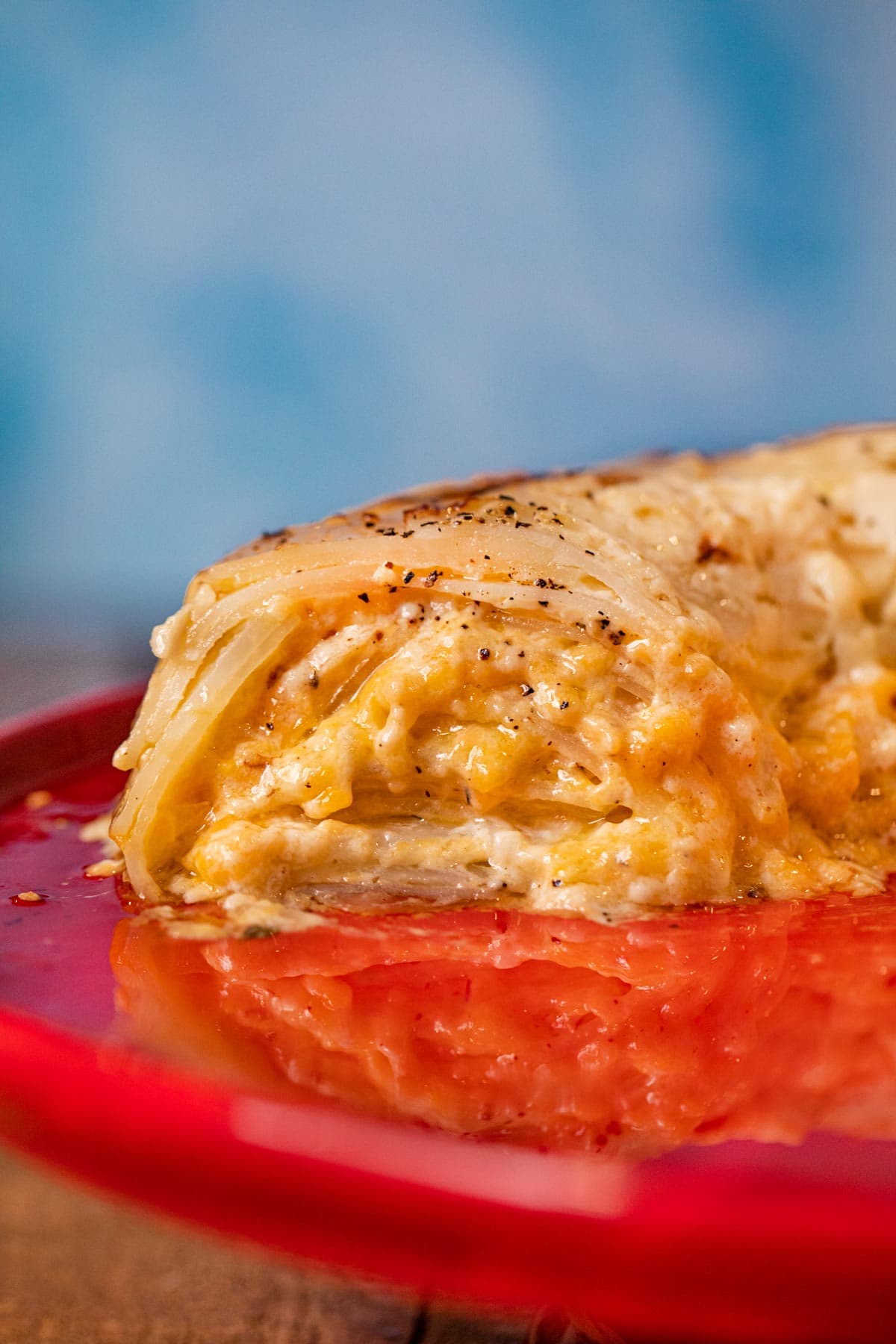 cross-section of Scalloped Potato Bundt on cake stand