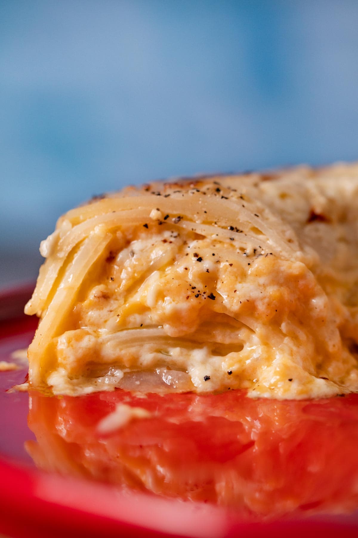 cross-section of Scalloped Potato Bundt on cake stand