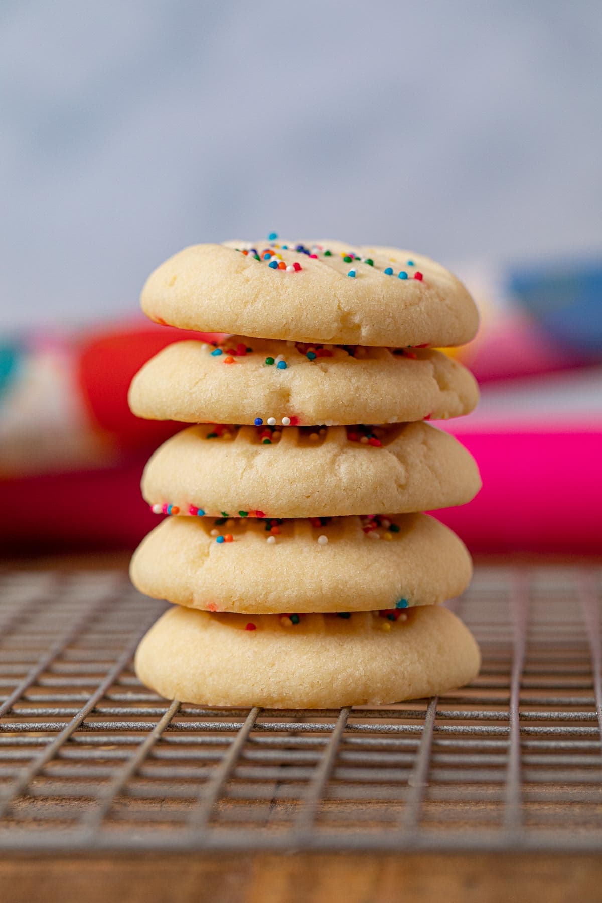 Whipped Shortbread Cookies in stack on wire rack