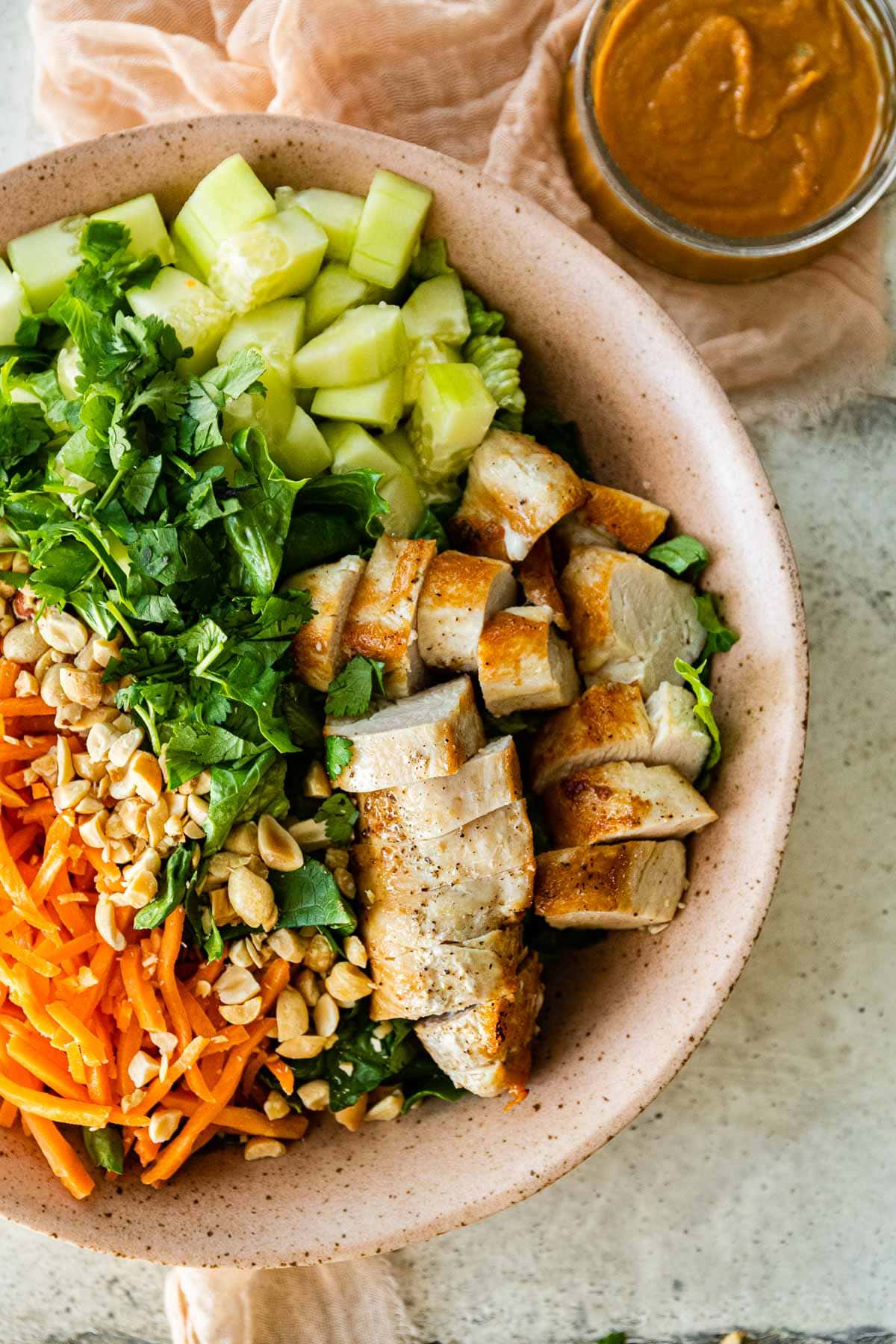 Asian Chicken Salad with Sesame Peanut Dressing ingredients in mixing bowl