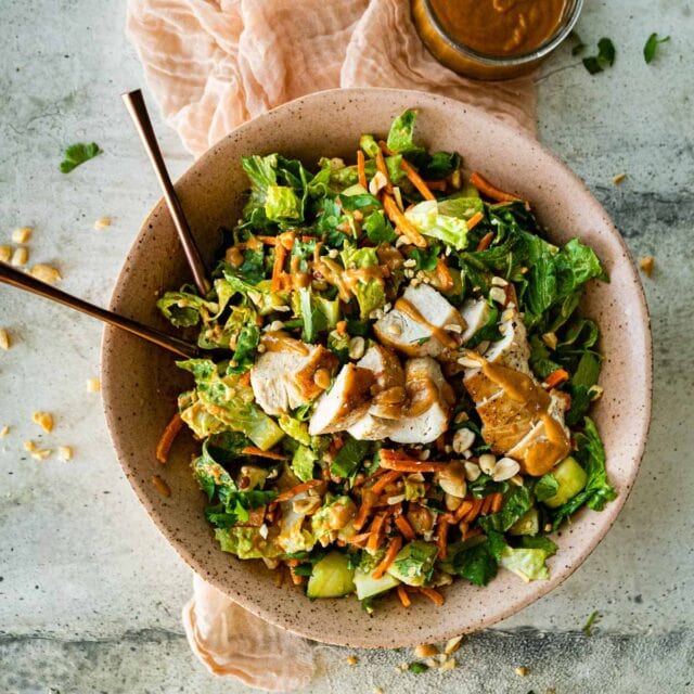 Asian Chicken Salad with Sesame Peanut Dressing in serving bowl 1x1