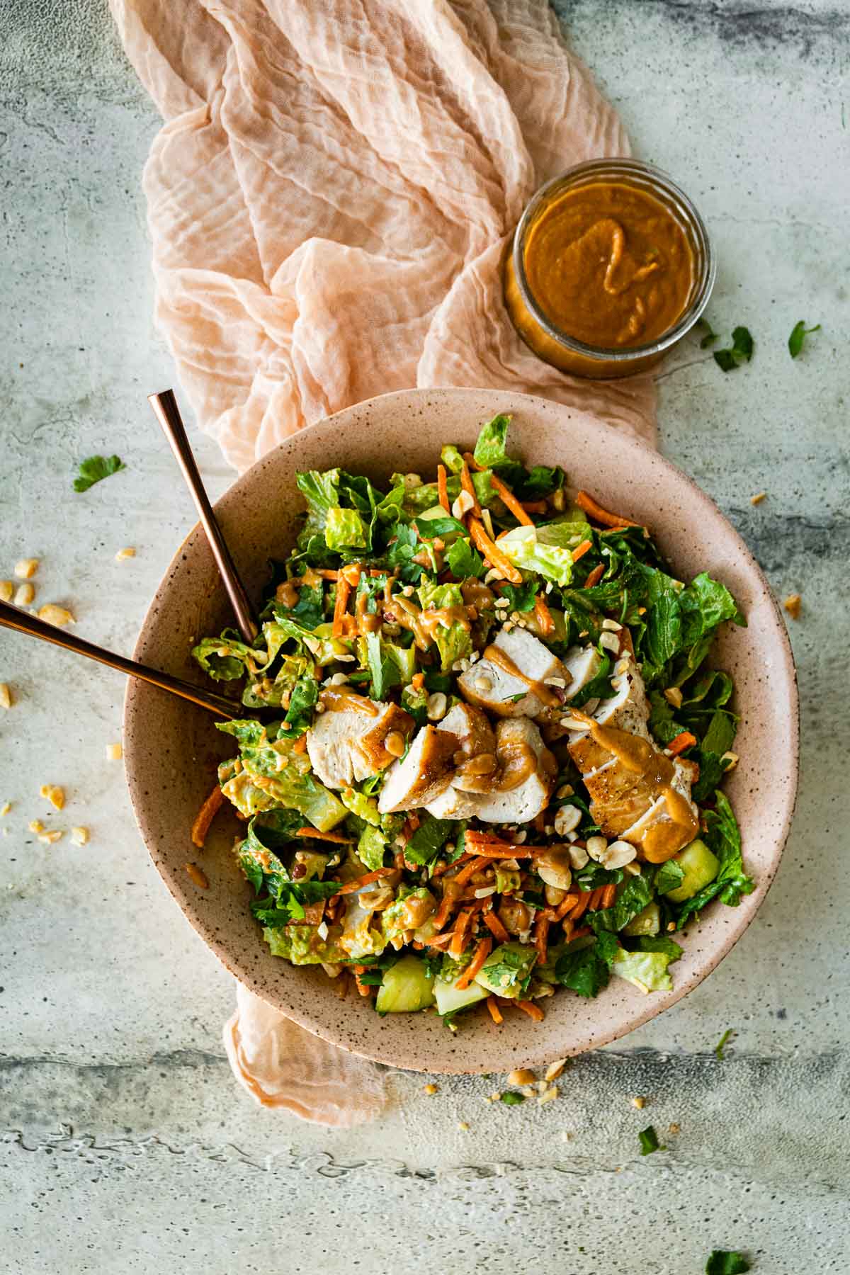 Asian Chicken Salad with Sesame Peanut Dressing in serving bowl