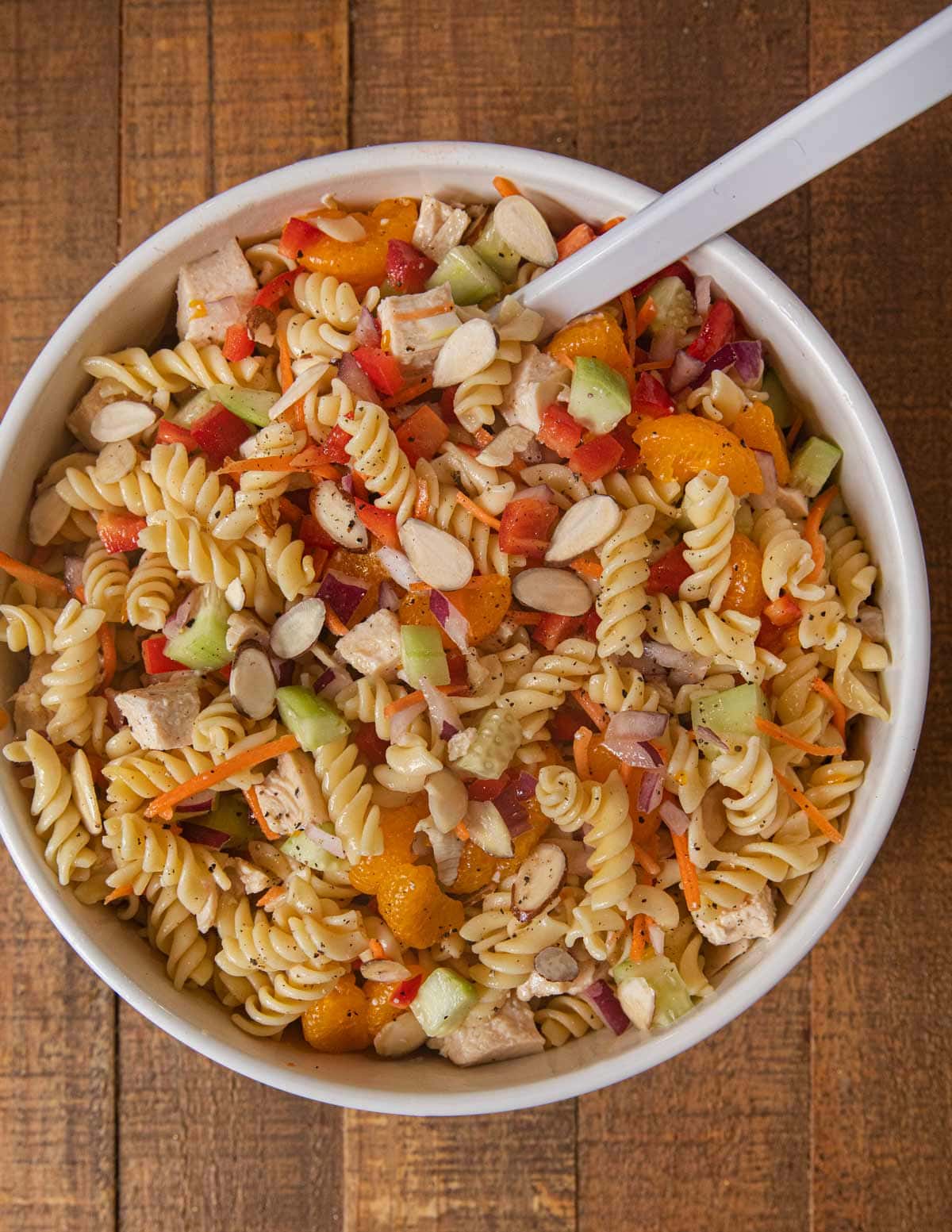 Mandarin Chicken Pasta Salad with ingredients mixed together