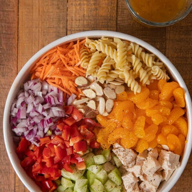 Mandarin Chicken Pasta Salad ingredients in white bowl