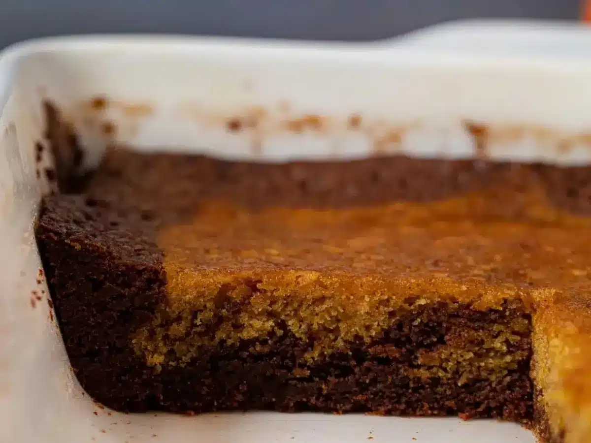 Brownies in pan with piece removed