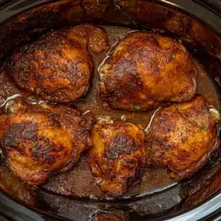 Seasoned chicken thighs in a crock pot