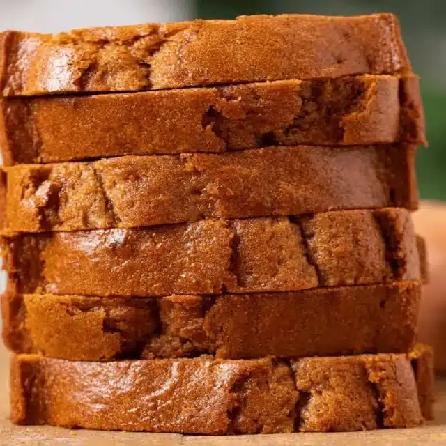 Sliced stacked baked bread on a table