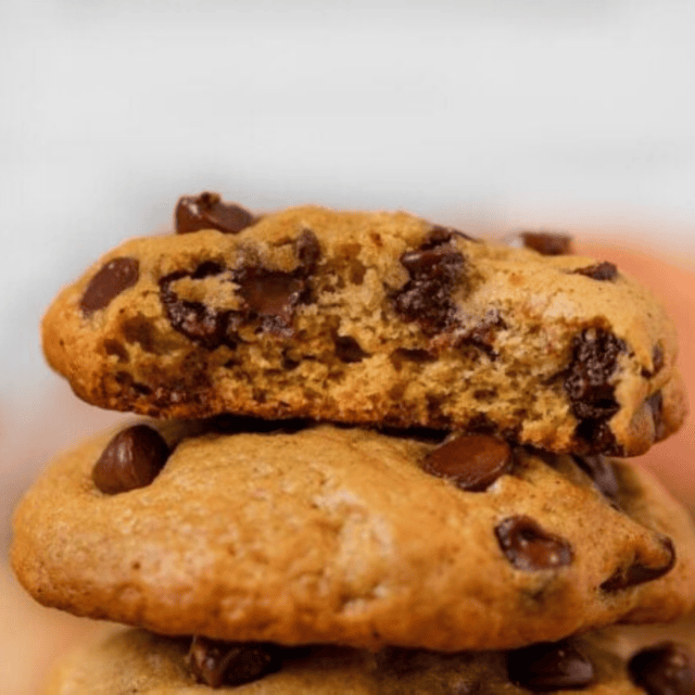 stacked cookies with bite taken out of the top