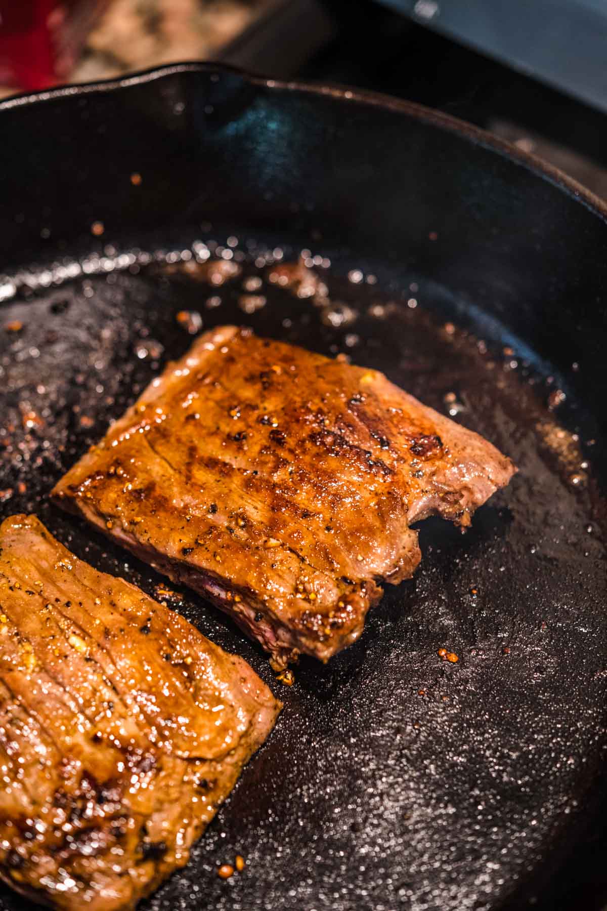 Thai Beef Salad skirt steak cooking in skillet