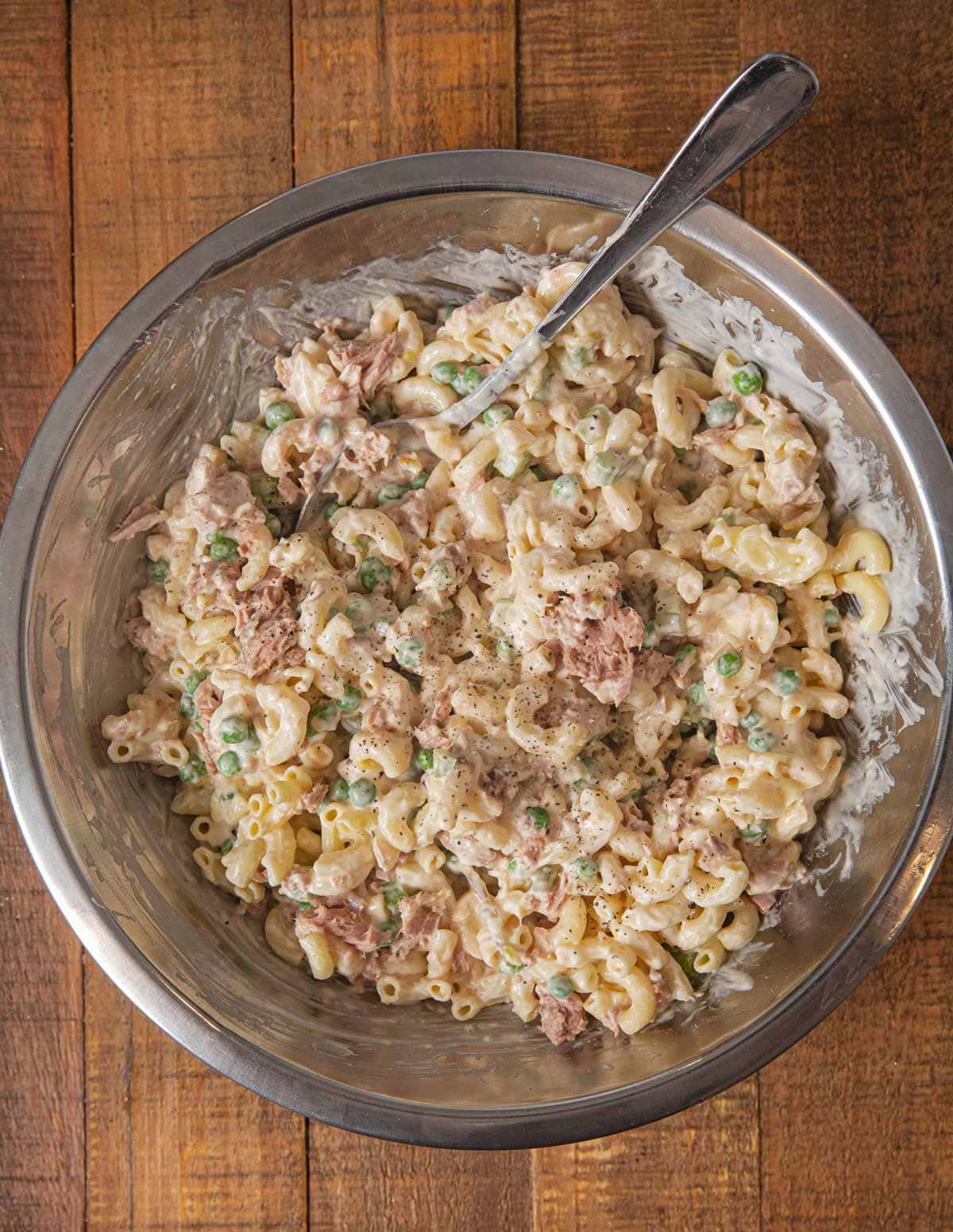 Tuna Pasta Salad in mixing bowl with ingredients mixed