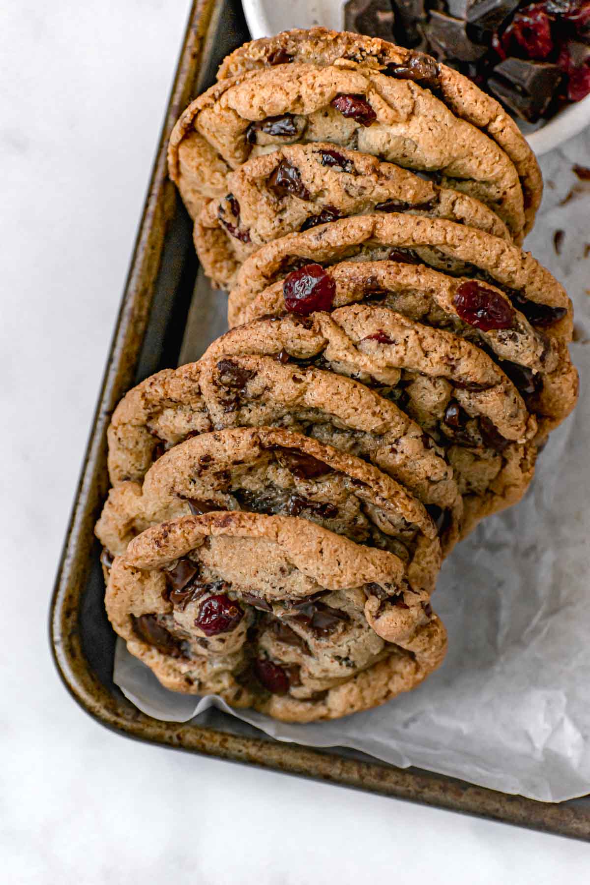 Cranberry Chocolate Chunk Cookies on parchment