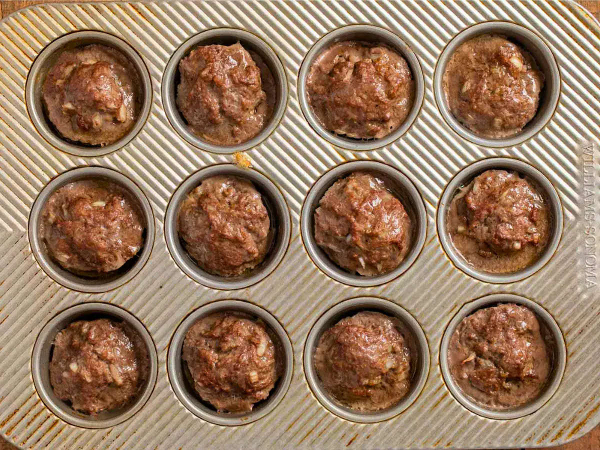 cooked ground beef in a circular baking tin pan