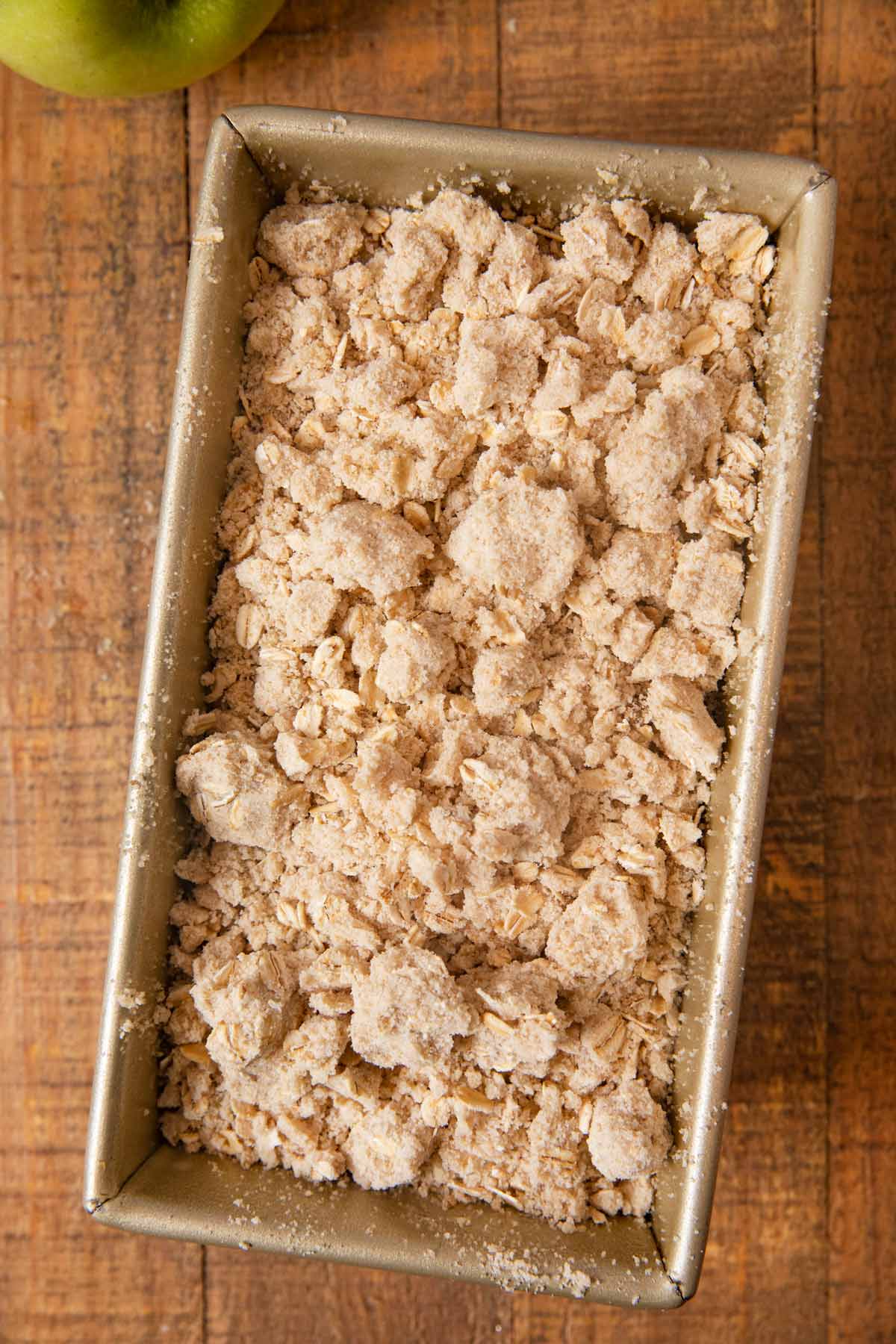 Apple Crisp Bread batter and topping in loaf pan before baking