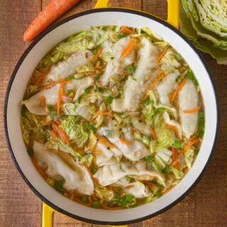 Asian Potsticker Soup in pot with cabbage and carrots