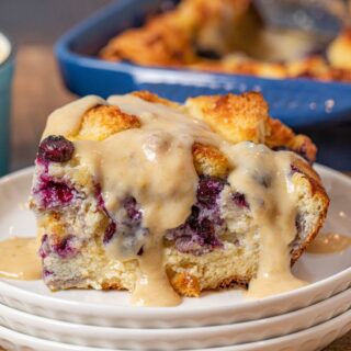 Blueberry Bread Pudding serving on plate with lemon-vanilla glaze