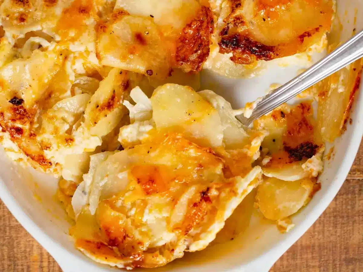 Spoonful of potato casserole in dish