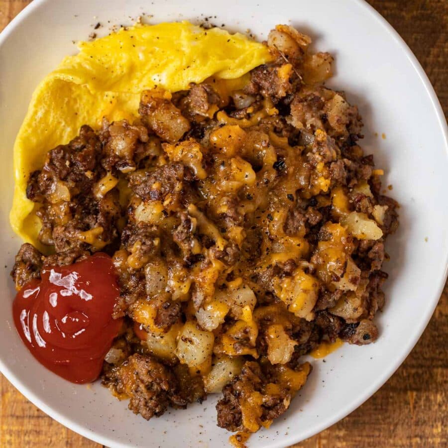 Cheesy Hamburger Hash on plate with egg