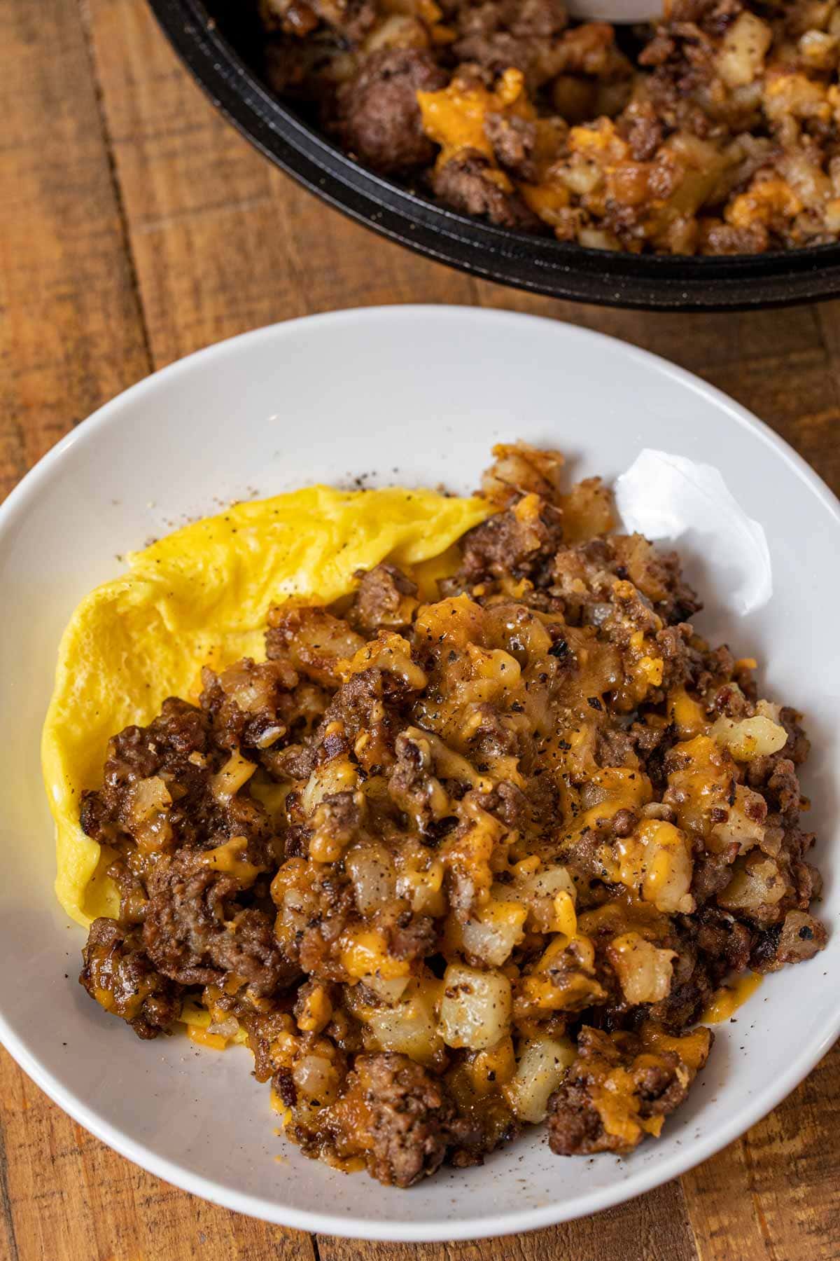 Cheesy Hamburger Hash on plate with egg