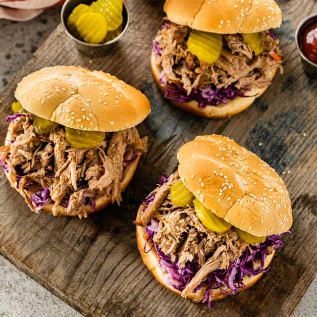 Coco Cola Pulled Pork three sandwiches with pulled pork and garnish
