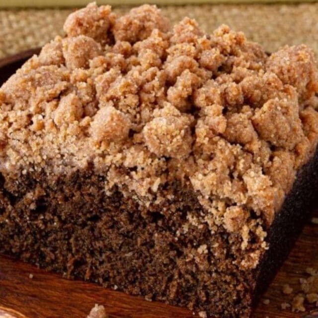 A piece of Crumb Cake on a plate.