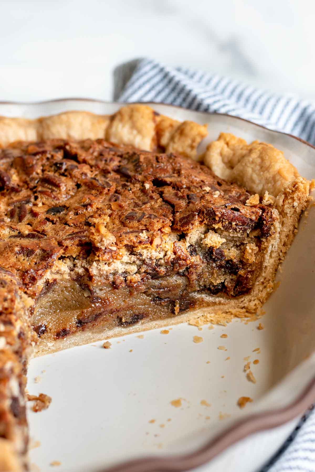 Kentucky Derby Pie with slice removed in pie dish