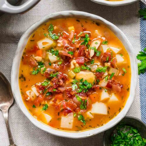 Chowder in bowl with bacon and parsley garnish