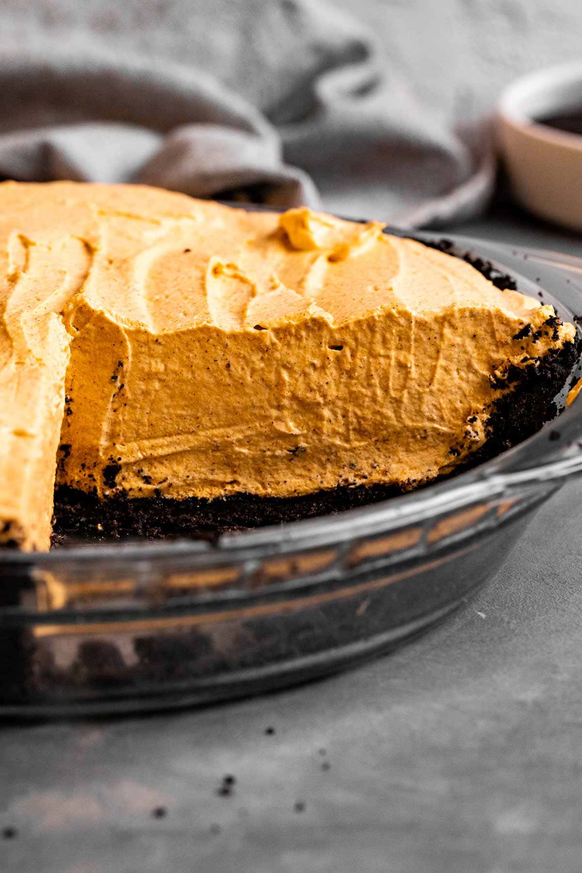 Chocolate Oreo Pumpkin Whip Pie in pie dish sliced