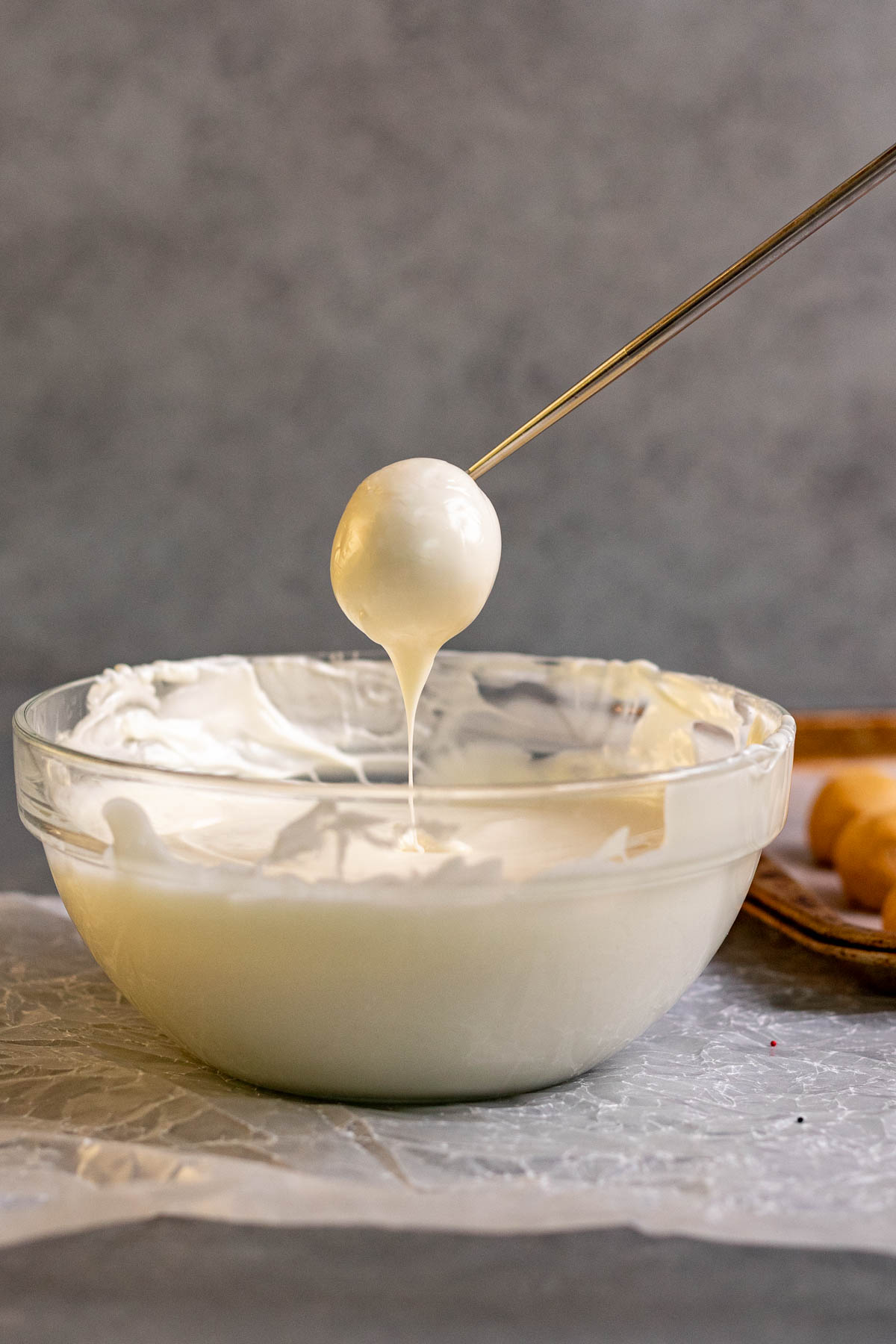 Peanut Butter Snowballs ball dipped in melted white chocolate