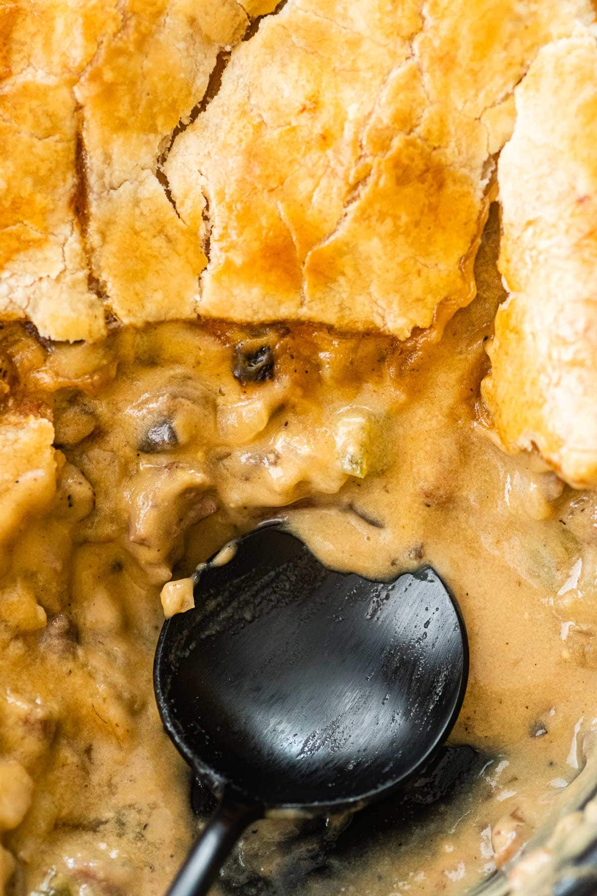 Philly Cheesesteak Pot Pie sliced open with spoon