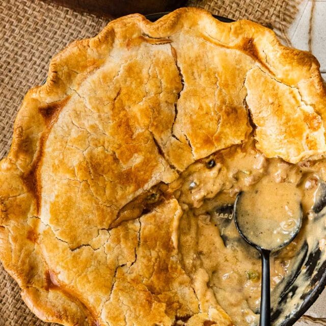 Cheesesteak Pot Pie sliced open with spoon