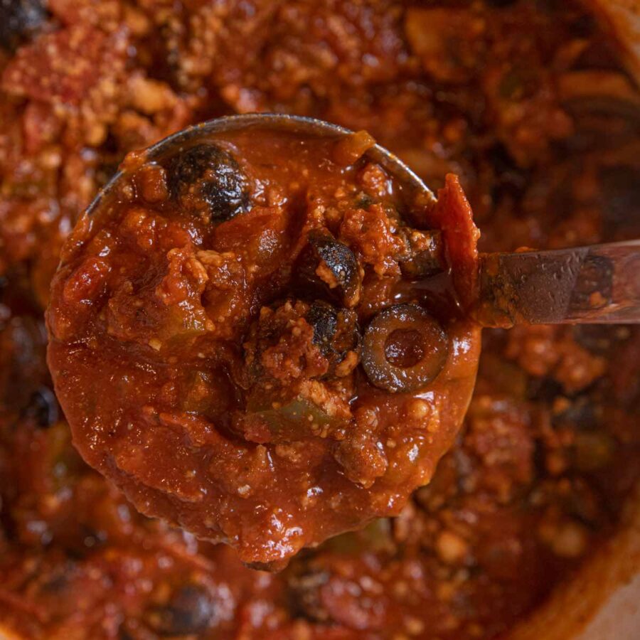 Sausage Combo Pizza Soup serving in ladle