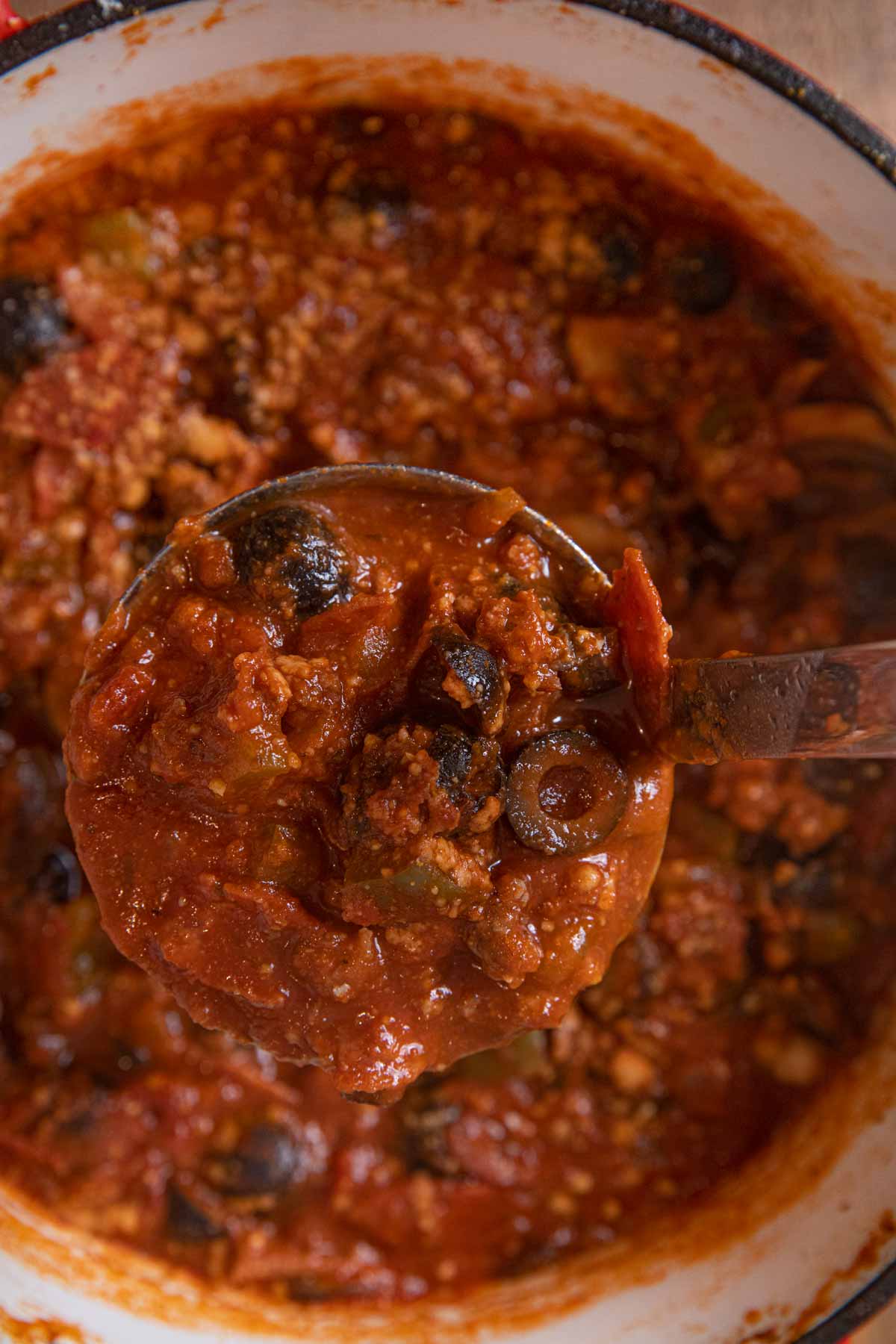 Sausage Combo Pizza Soup serving in ladle