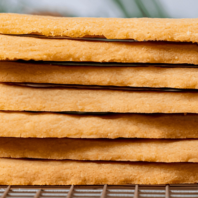 a stack of buttery cookies on cooling rack