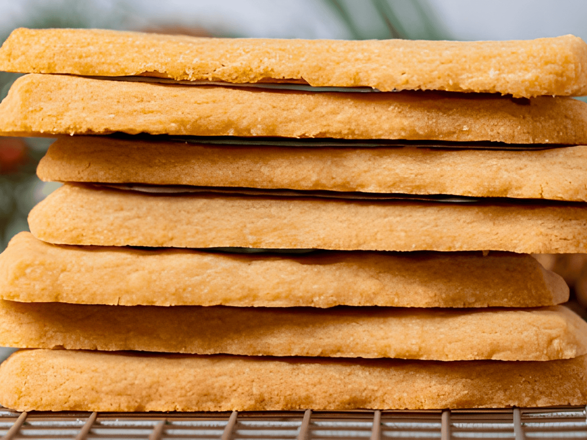 a stack of buttery cookies on cooling rack