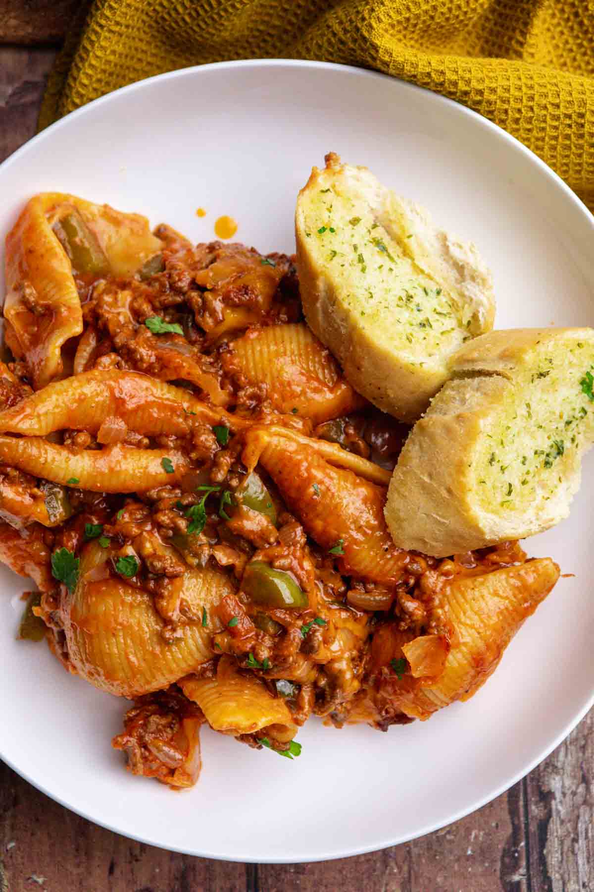 Sloppy Joe Pasta on plate with garlic bread