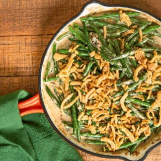 green bean casserole in pan with towel