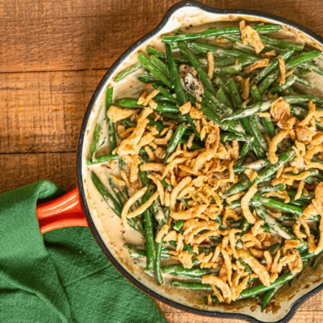 green bean casserole in pan with towel