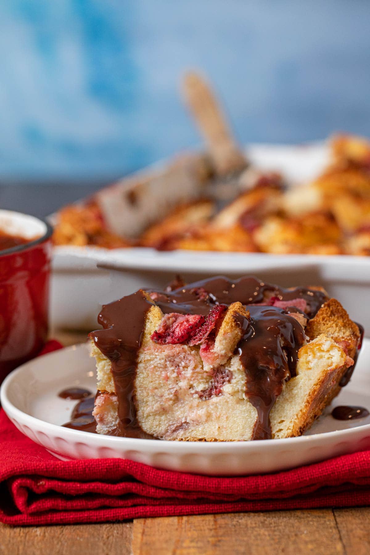 Strawberry Nutella Bread Pudding serving on plate with Nutella sauce