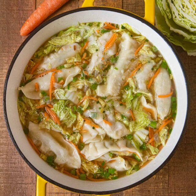 Asian Potsticker Soup in pot with cabbage and carrot