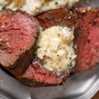 Tenderloin on a serving plate with Horseradish sauce.