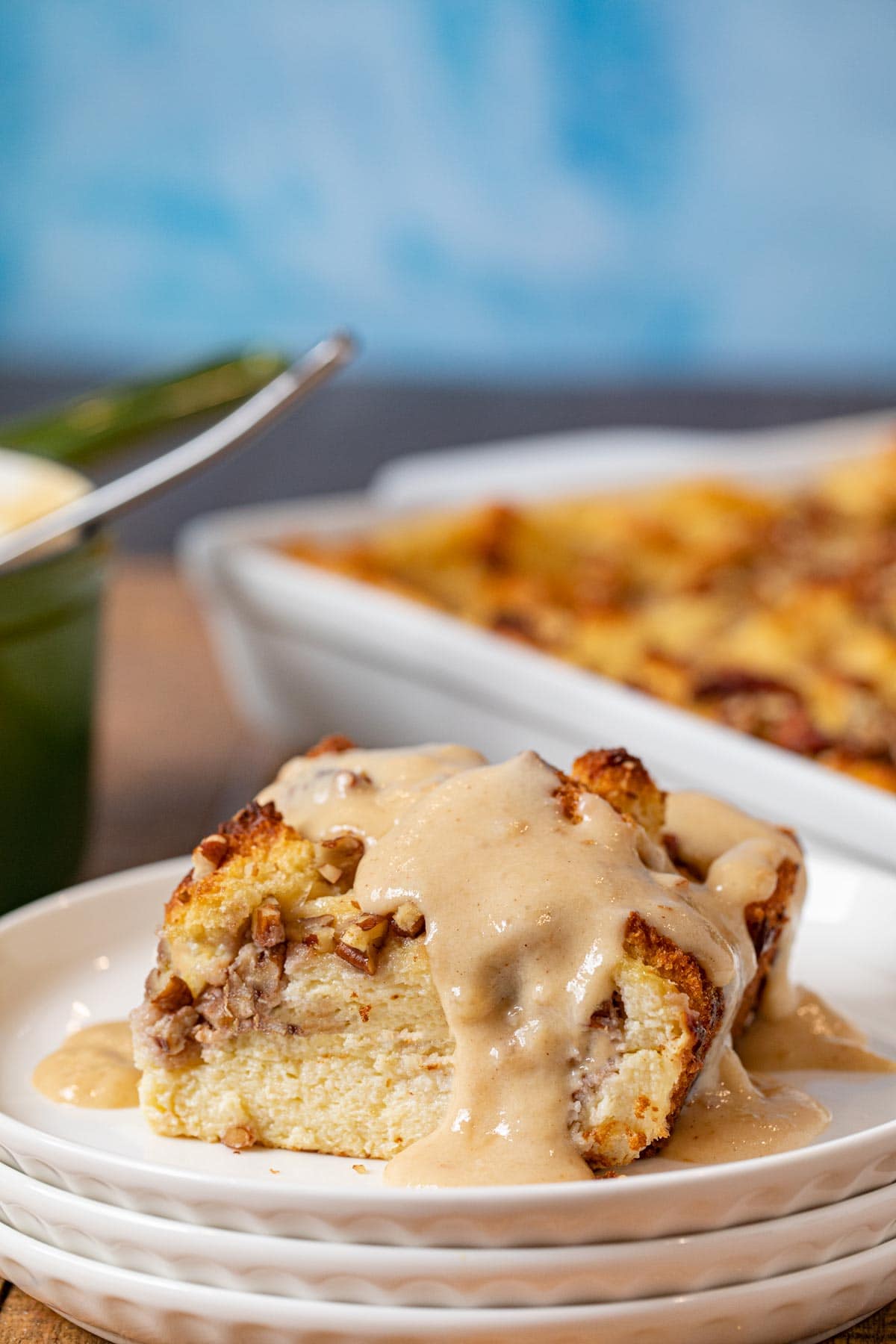 Bourbon Pecan Bread Pudding serving on plate with bourbon vanilla sauce