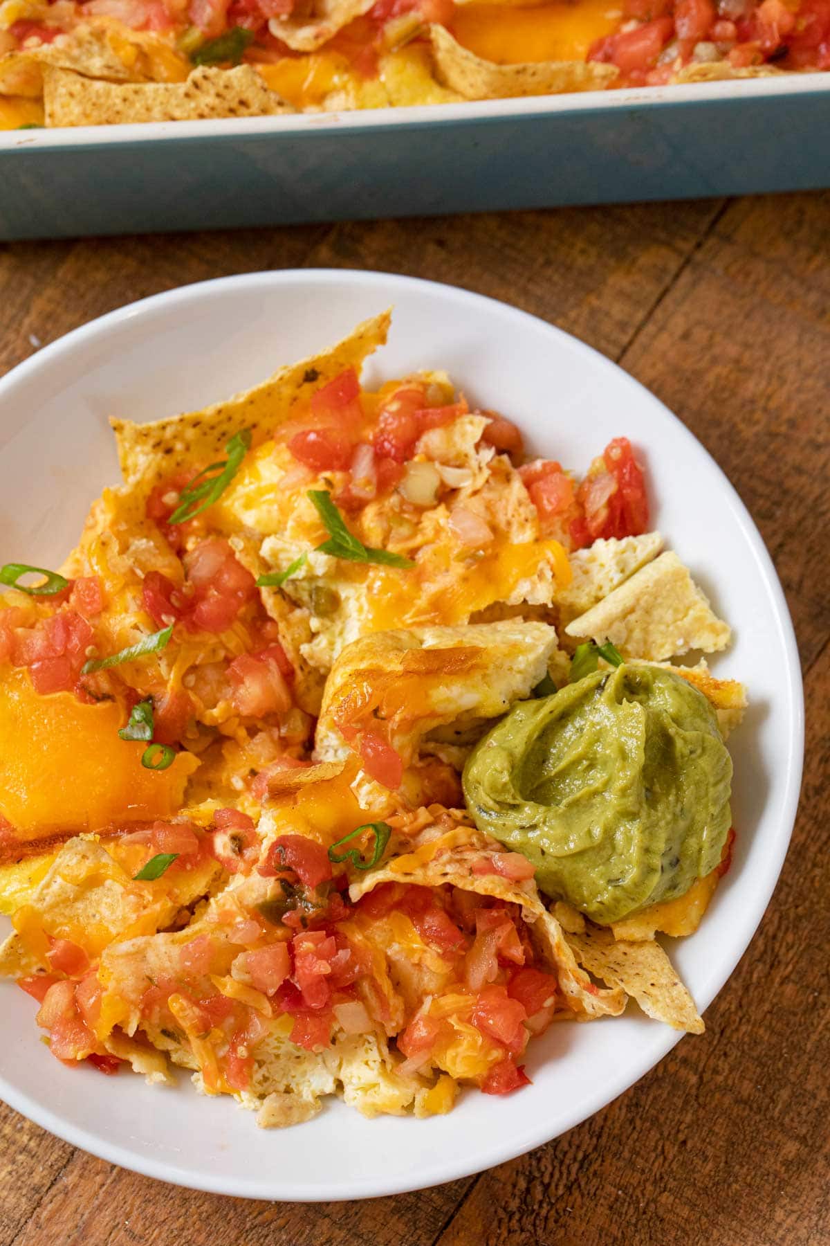 Cheesy Baked Chilaquiles serving on plate