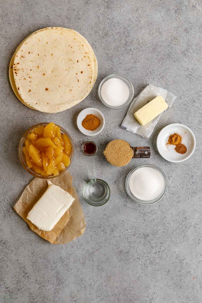 Cinnamon Apple Enchiladas ingredients in bowls and spread out