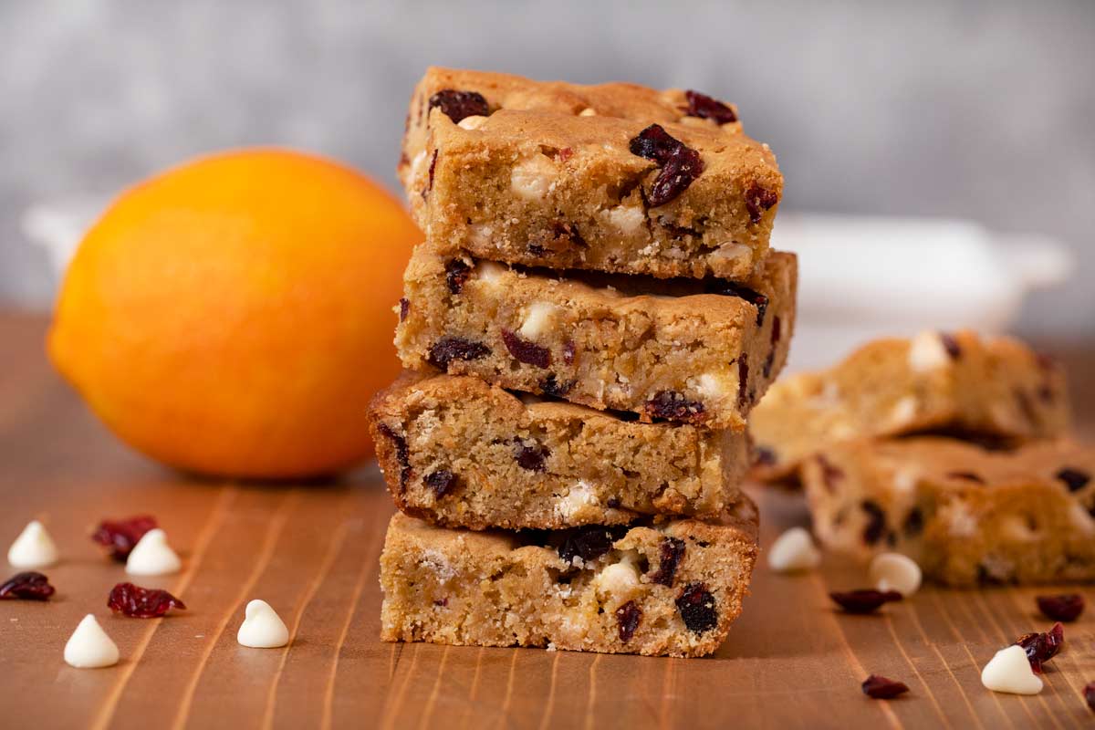 Cranberry Orange Blondies with Orange in the background