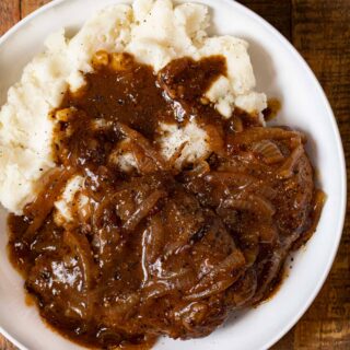 Cube Steak and Gravy on plate with mashed potatoes
