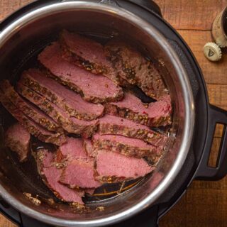 Beef in pressure cooker, sliced, overhead view