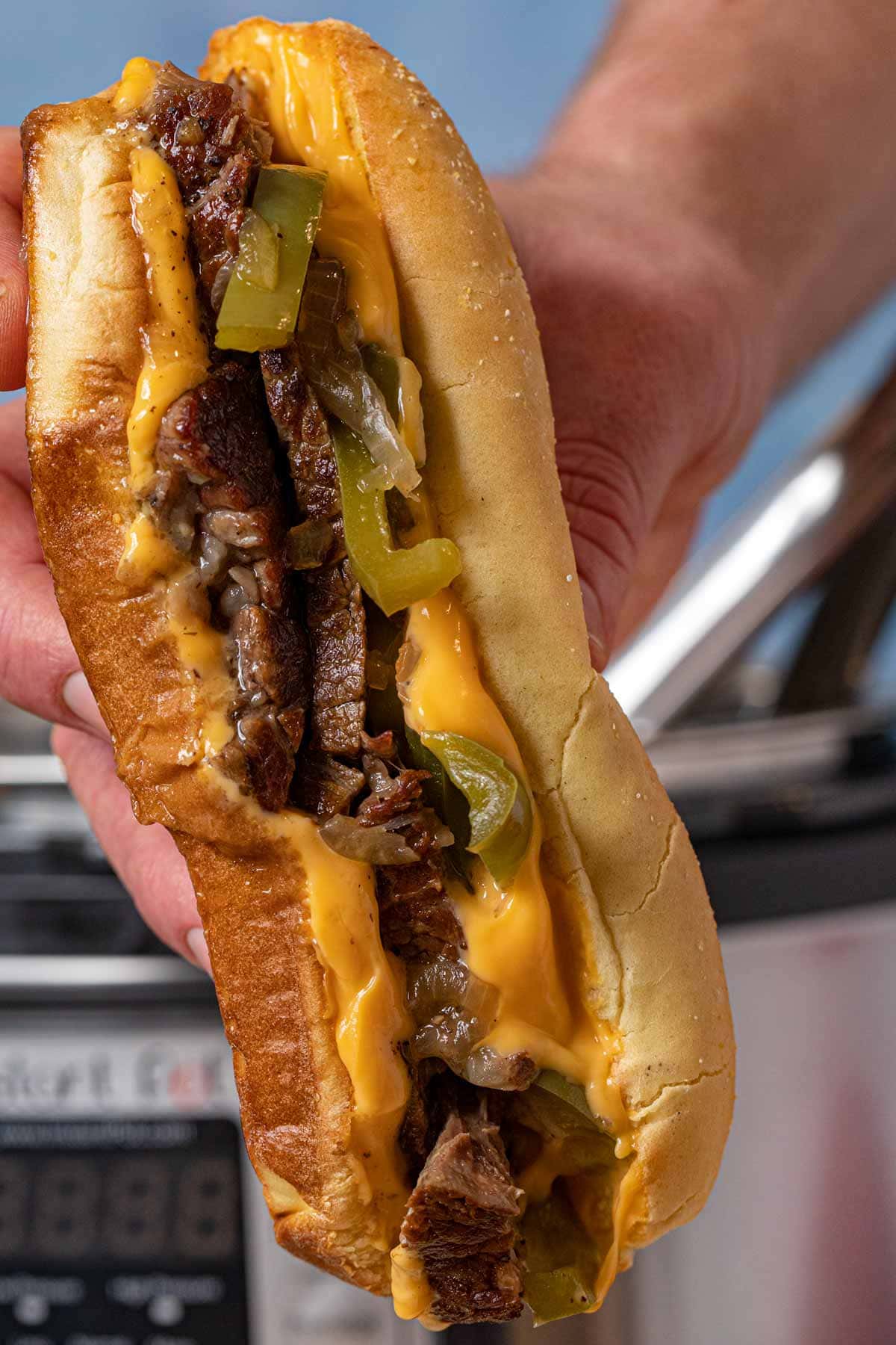 Instant Pot Philly Cheese Steak Sandwich held vertically